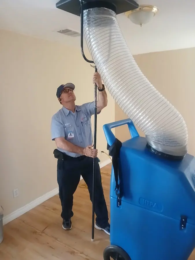 Furnace Tune-Up technician using HEPA equipment in Warrenton